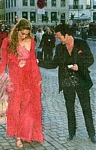 danish B.T. 2. Apr. 2005 - with Thomas at Hans Christian Andersen gala, red dress, looks down
