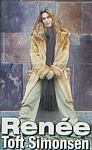 danish - 2002 wearing fur coat standing on a grey wall